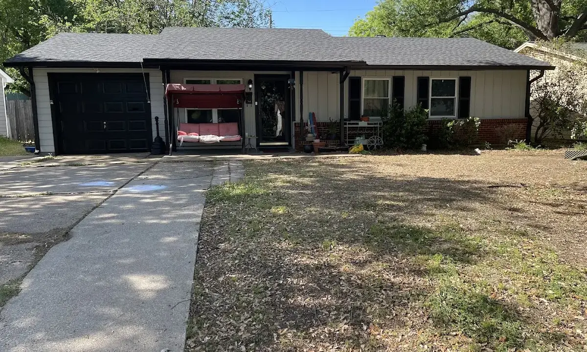 Hail Damage Roof Repair crew at work on a residential roof in Navarre